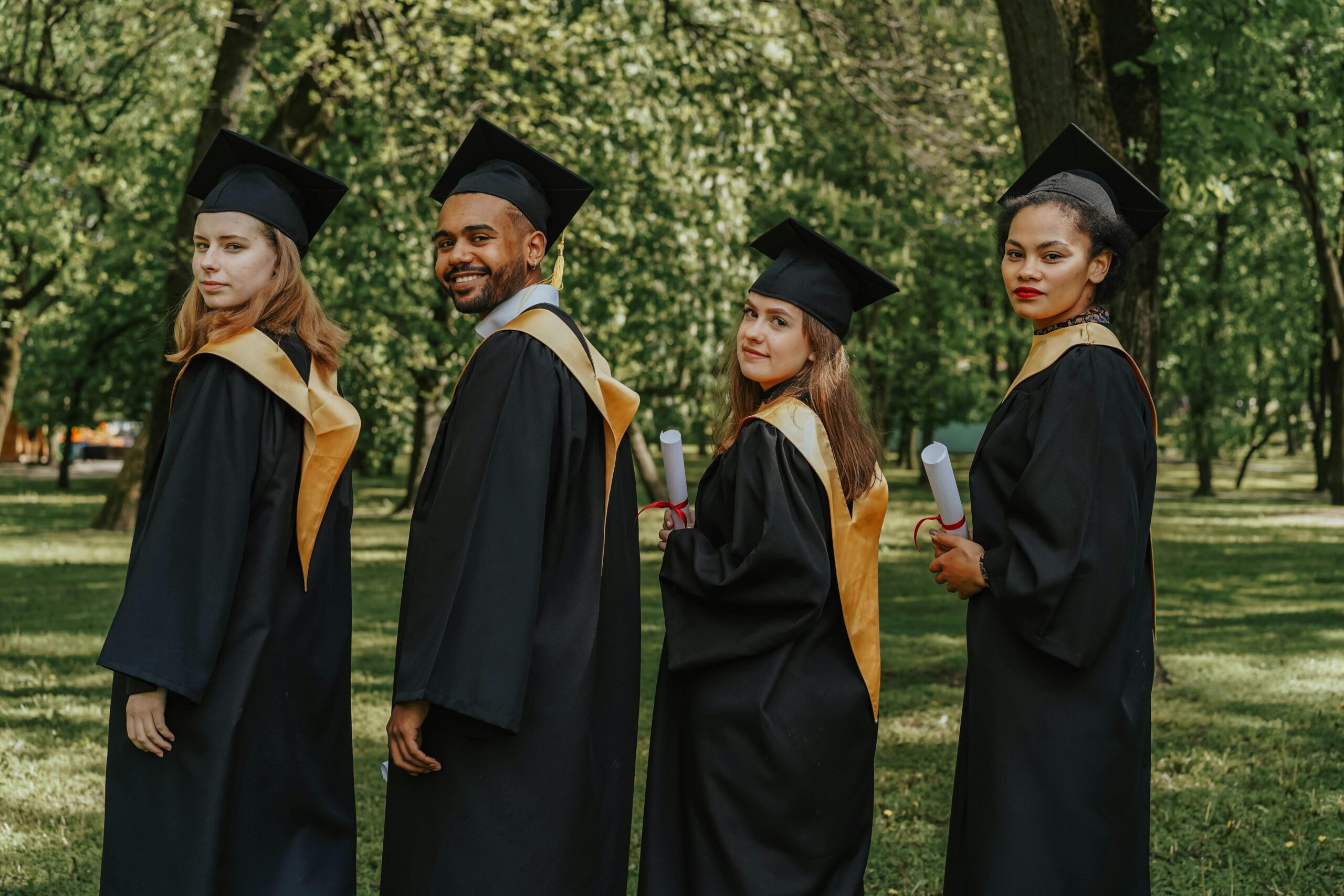 People in graduation gowns.